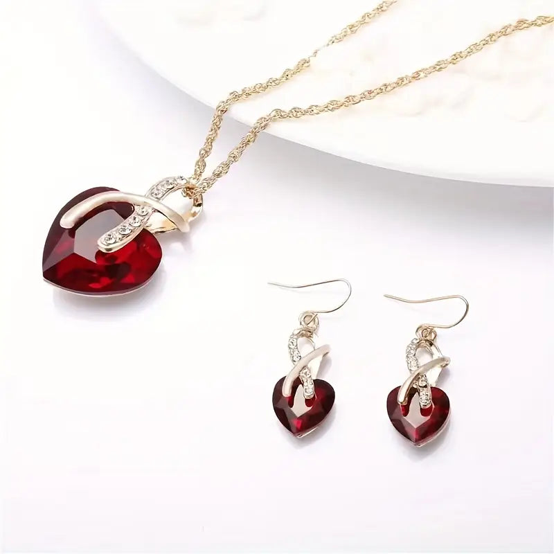 Conjunto de Joyas de Corazón Retorcido de Oro y Rubí