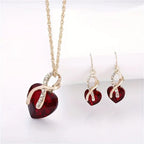 Conjunto de Joyas de Corazón Retorcido de Oro y Rubí
